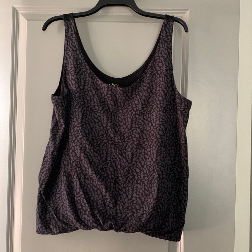 Loft top with tucked front. Can be dressy or casual.
